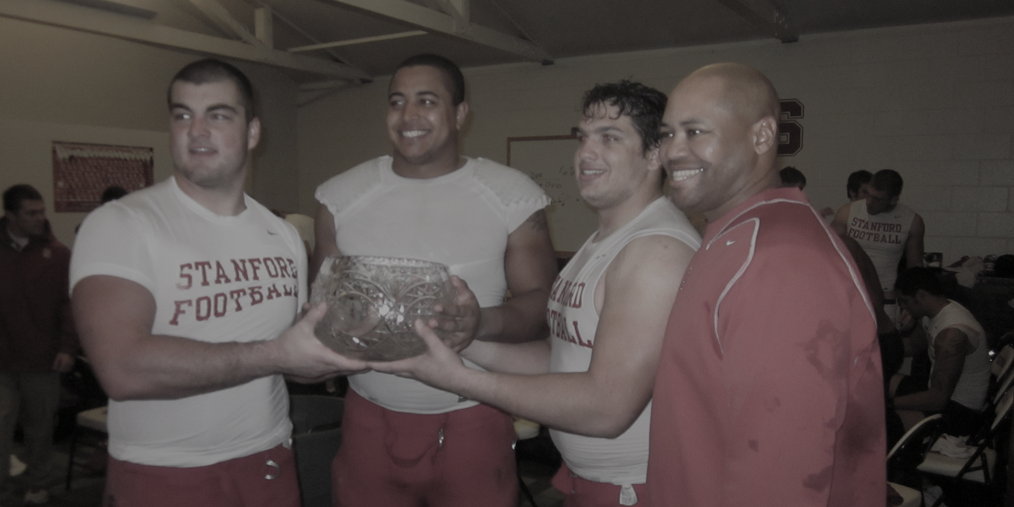 Stanford Football team celebrating with The Legends Trophy